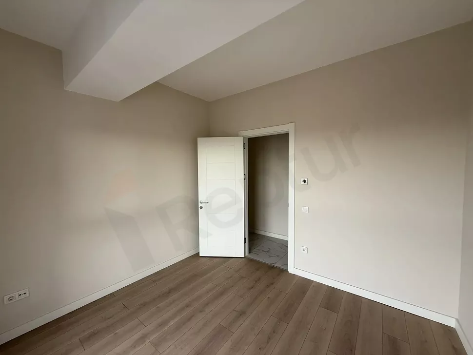 Bright and spacious bedroom area of a modern 3+1 apartment in Cekmekoy, Istanbul.