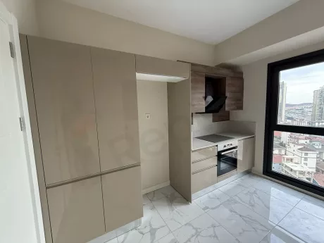 Modern and spacious kitchen area of a residential apartment.