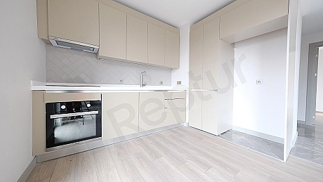 Detail of modern kitchen countertop and cabinets.