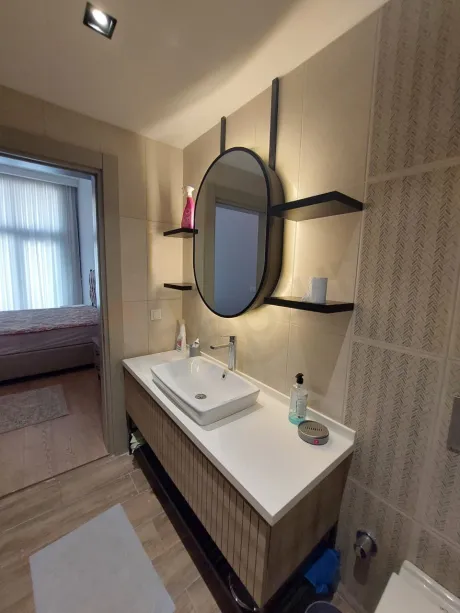 Modern and stylishly designed bathroom interior with high-quality tiling.
