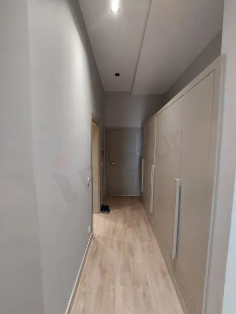 Interior view of a spacious and bright modern apartment hallway