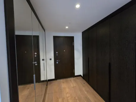 Entrance area and doorway of a modern and stylish residence apartment.