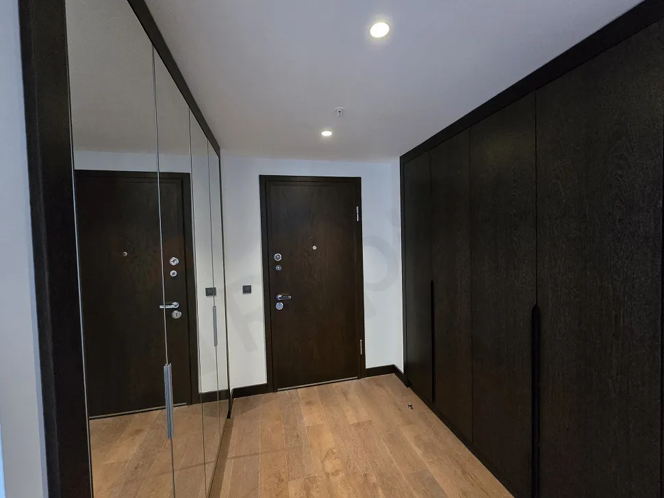 Entrance area and doorway of a modern and stylish residence apartment.