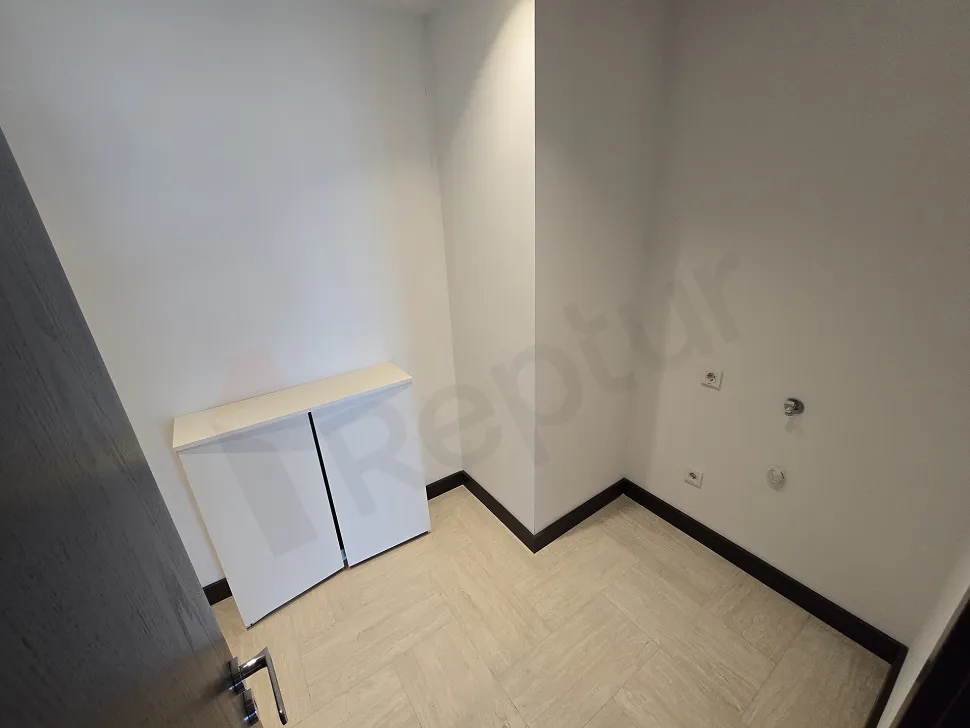 Spacious and organized storage unit area inside a modern luxury residence building.