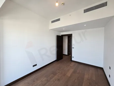 Bright and modern bedroom area with large windows in a luxury residence project in Sisli, Istanbul.