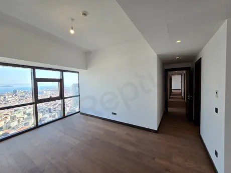 A spacious bedroom visual with modern design and large windows.