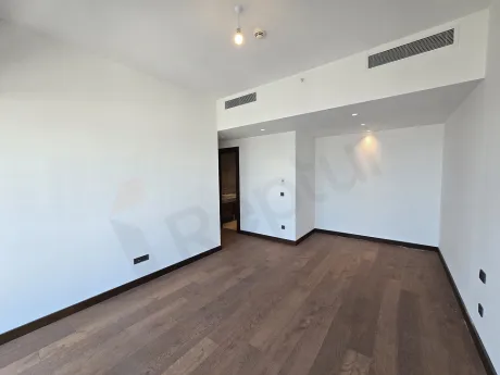Spacious and bright modern bedroom interior with a contemporary design.