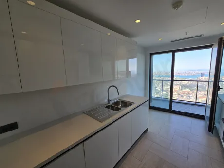 Modernly designed, spacious and bright kitchen area.