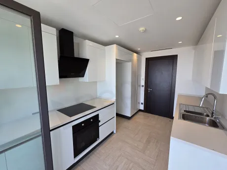 Spacious and bright kitchen area of a modern residence apartment.