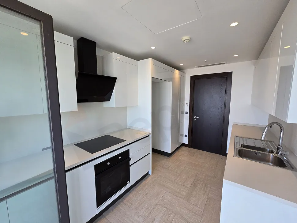 Spacious and bright kitchen area of a modern residence apartment.