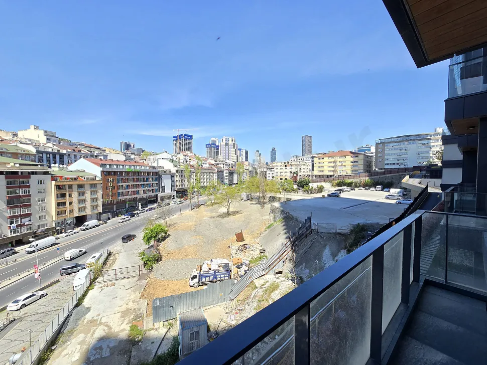 Spacious balcony area of a modern apartment with city views in Şişli.