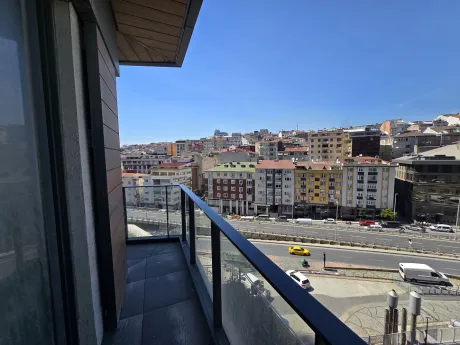 Spacious balcony of a modern residence apartment in Sisli with a panoramic city view.