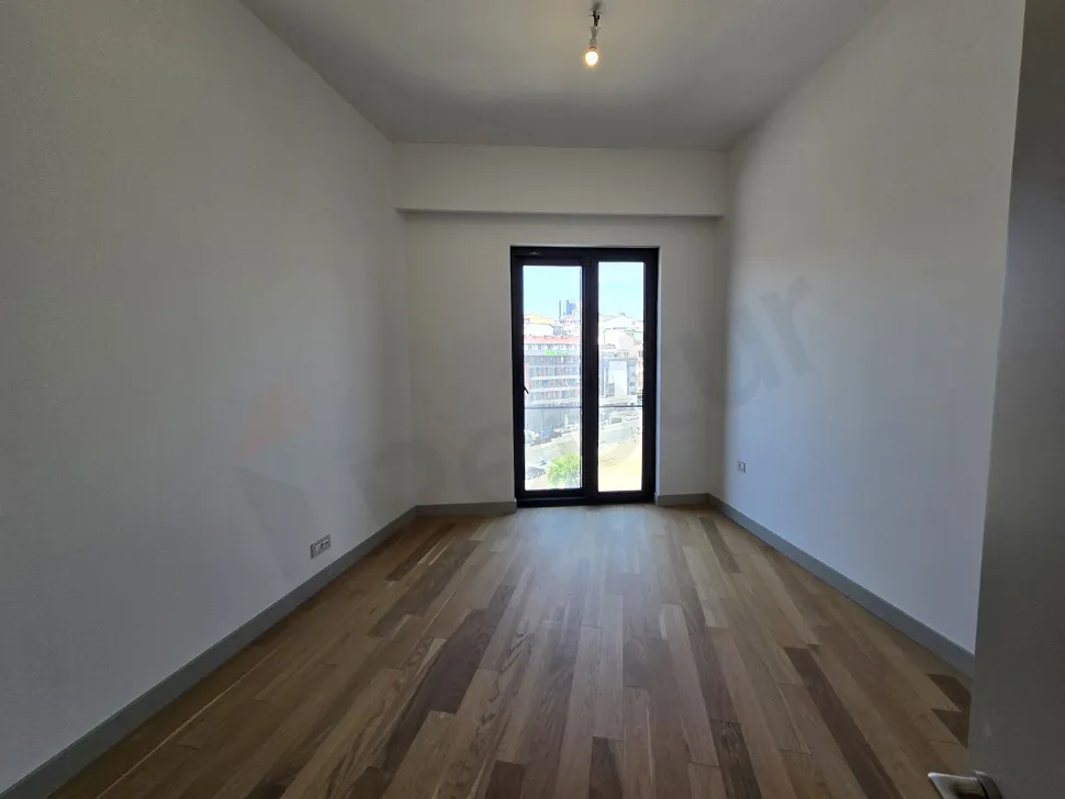 Modernly designed, spacious and bright bedroom view.
