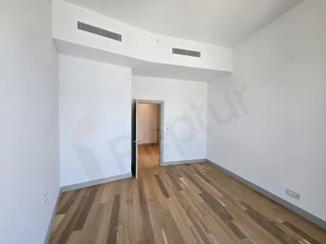 Interior view of a modern and spacious bedroom.