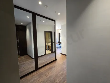 Entrance door and hallway area of a modern residence apartment.