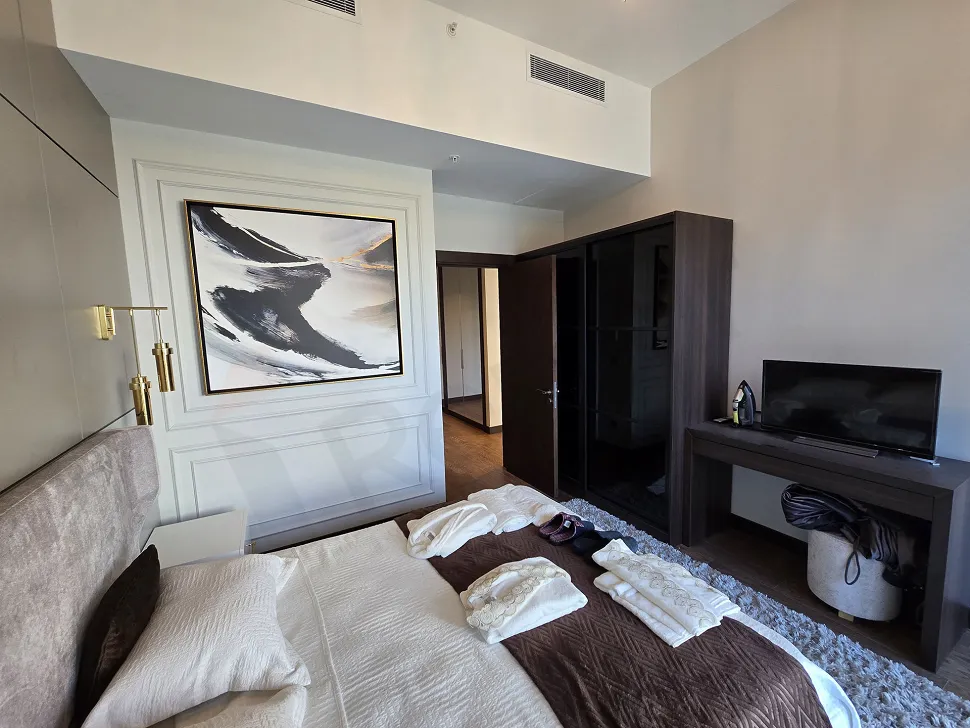 Modernly designed, spacious and bright bedroom interior with natural light.
