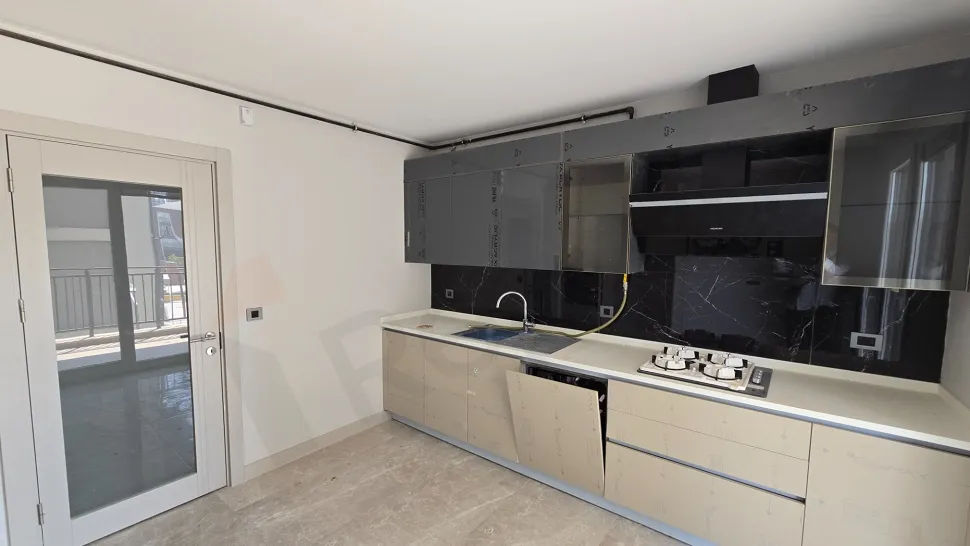 Spacious and bright modern kitchen design of a premium apartment.