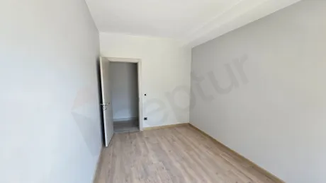 Interior view of a modern, spacious, and bright bedroom.
