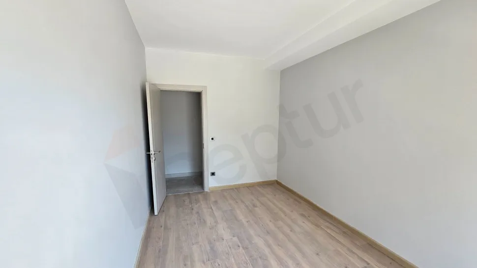 Interior view of a modern, spacious, and bright bedroom.