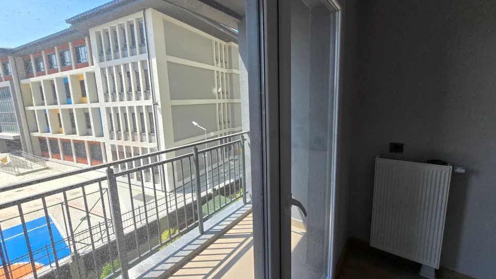Large balcony area and city view in a modern building.