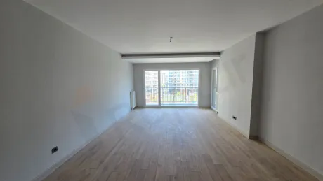 Bright and spacious living room with modern design and large windows in a new building in Beylikdüzü.