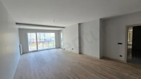 Spacious and modern living room area of a large apartment.