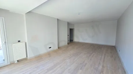 Spacious and modern living room area with a bright design.