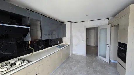 Modern designed, spacious and bright kitchen area.