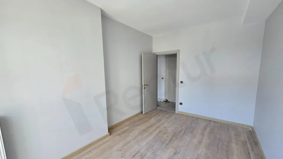 Interior view of a modern and spacious bedroom.