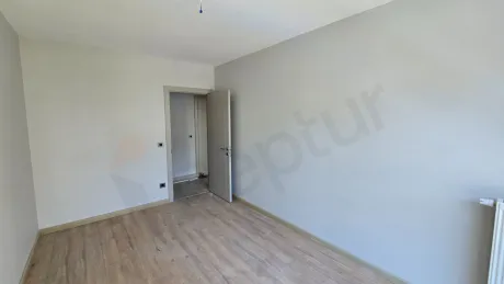 Interior view of a modernly designed, spacious and airy bedroom.