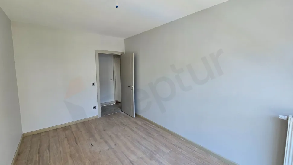 Interior view of a modernly designed, spacious and airy bedroom.