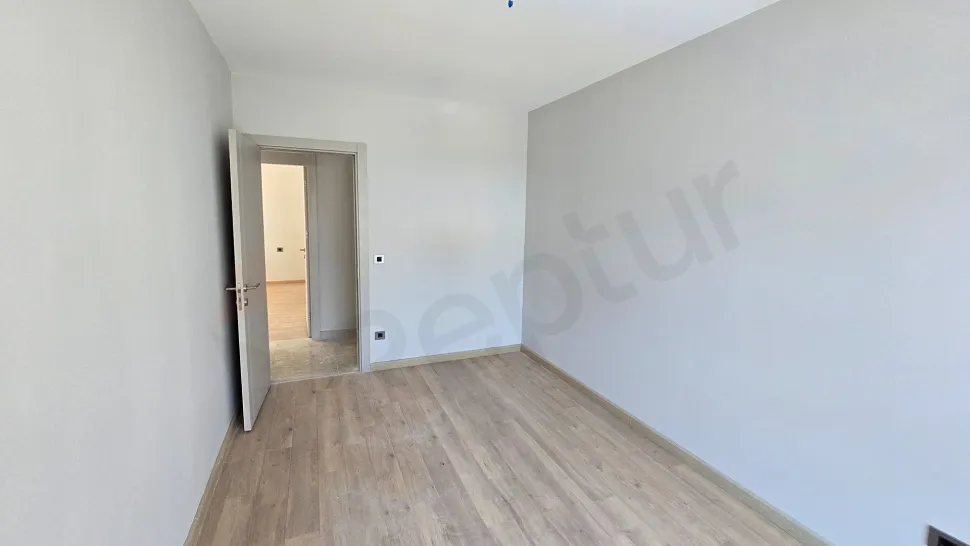 Interior view of a spacious and modern bedroom.