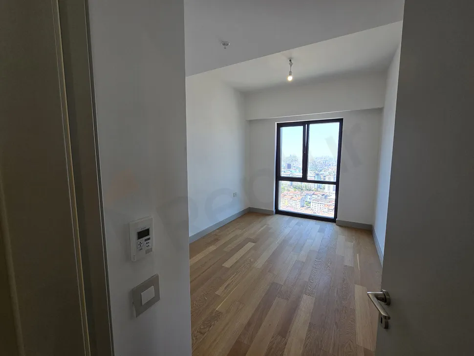 Modern and spacious bedroom design of a residence apartment with natural light.