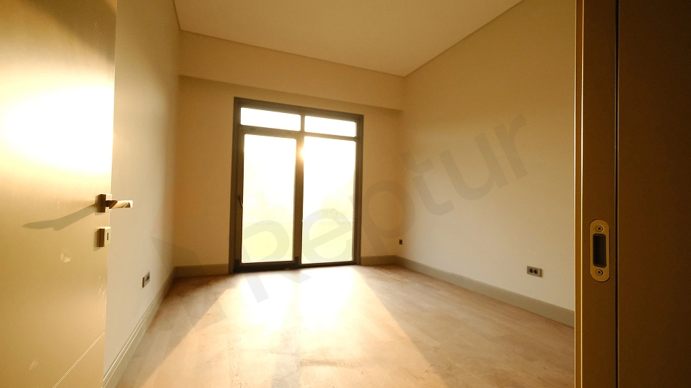 Image of a spacious and bright bedroom.