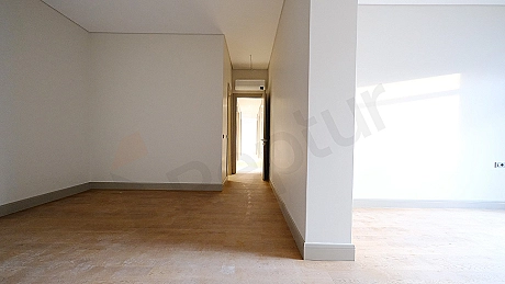 Spacious and bright apartment corridor.
