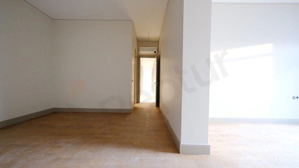 Spacious and bright apartment corridor.