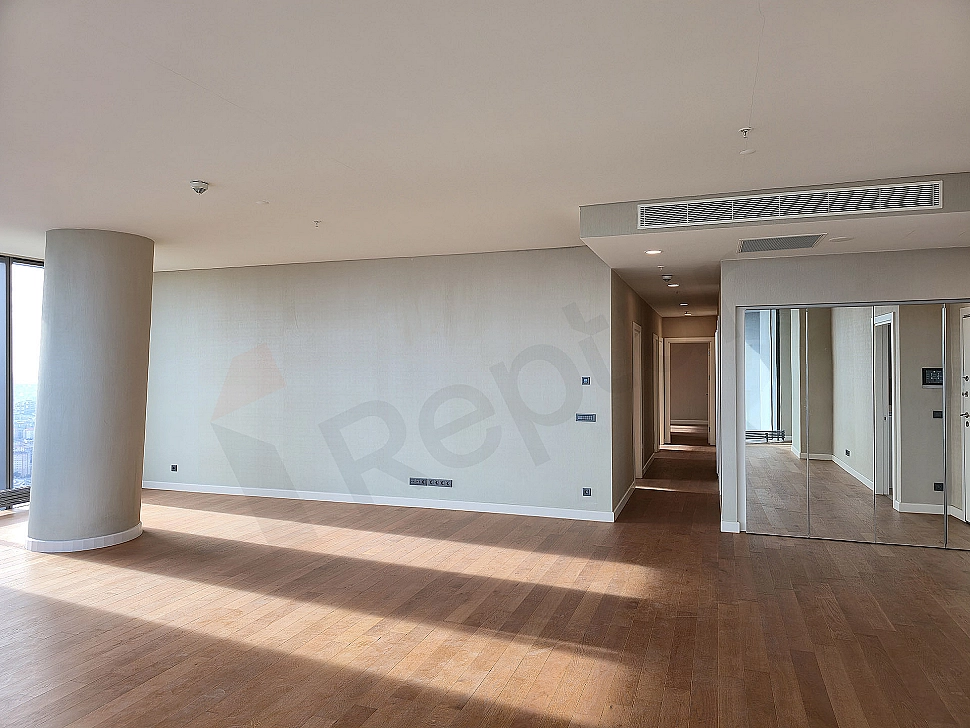 Modern living room interior: spacious, bright, stylish furniture and city view.