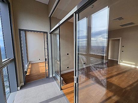 Photo of a luxury apartment with a large balcony.