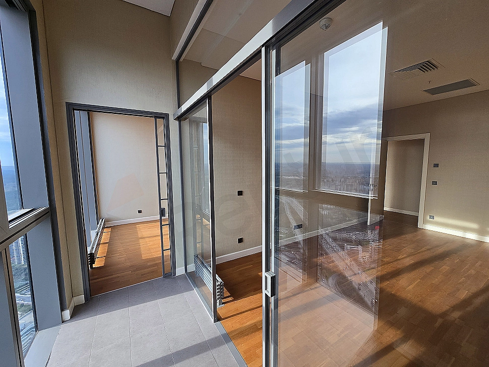 Photo of a luxury apartment with a large balcony.