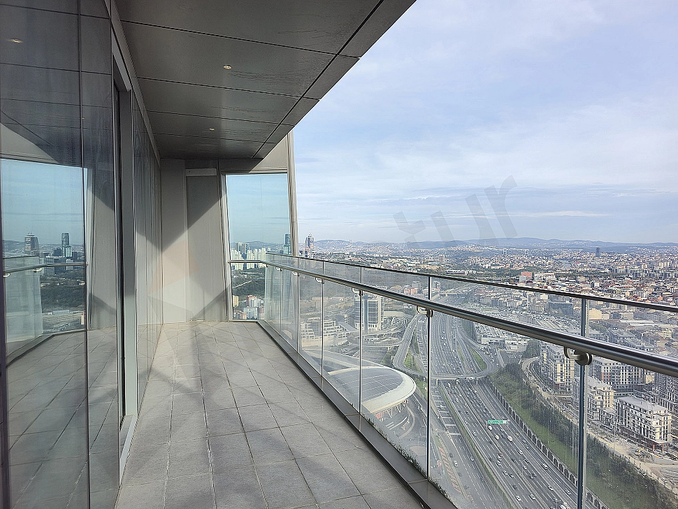Photo of a luxury apartment with a large balcony and sea view.