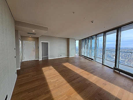 Modern living room interior with large windows, stylish furniture, and bright design.