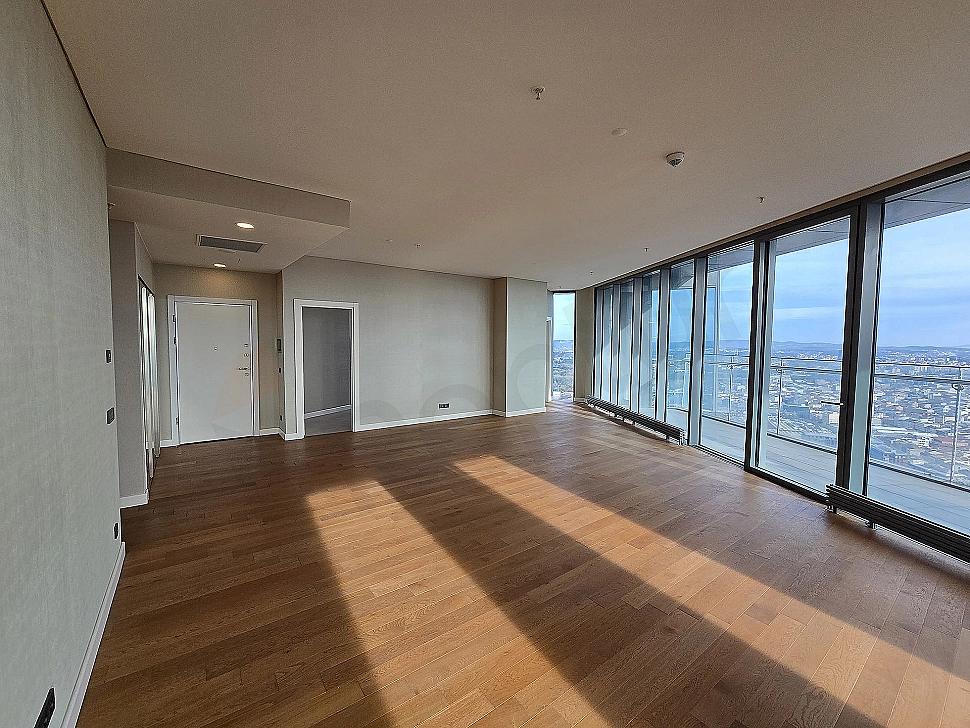Modern living room interior with large windows, stylish furniture, and bright design.
