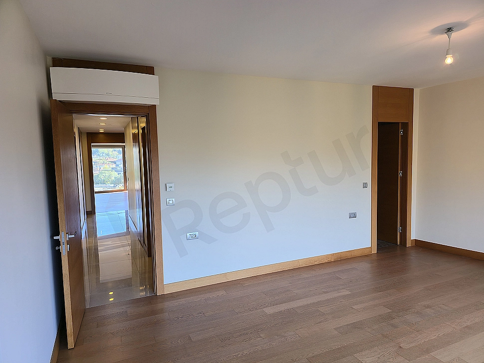 Modern bedroom interior: spacious double bed, wooden bedside tables, lampshades, carpet, window, and stylish decor.