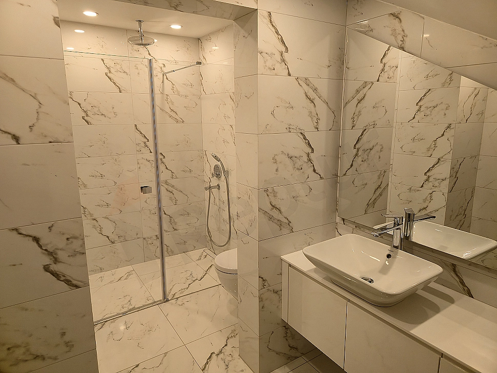 Luxury bathroom interior, modern design, wide sink, mirrored cabinet and bright atmosphere.