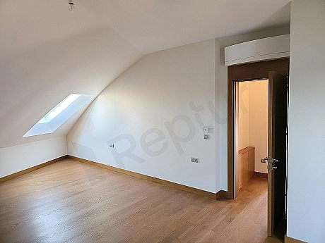 Luxury bedroom interior, modern design bed, stylish bedside tables and decorative lighting elements.