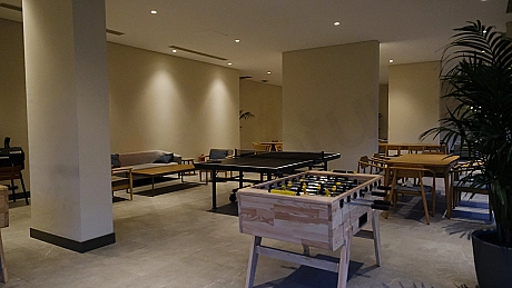 Modern gym with fitness equipment and large exercise area.