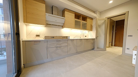 Detail of a modern kitchen counter and cabinets.