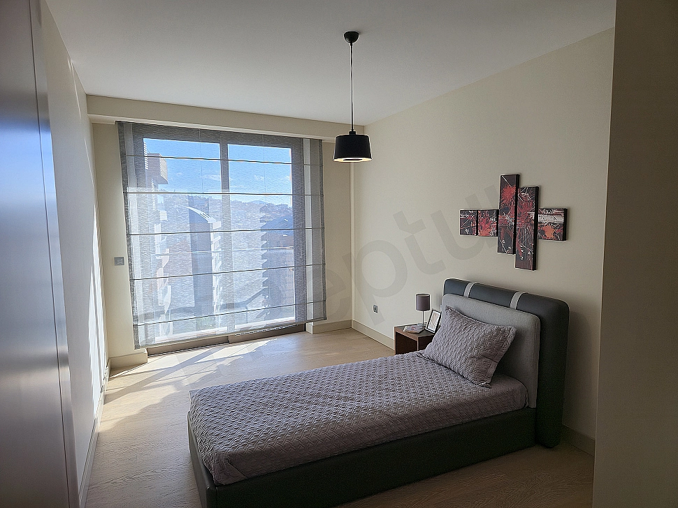 Modern designed, spacious and bright bedroom.