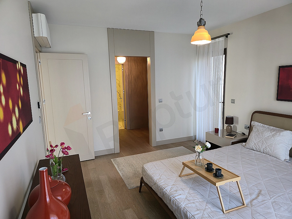 Stylish and modern designed bedroom with large windows.