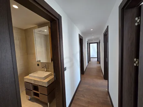 View of a spacious and bright corridor in a modern residence apartment.
